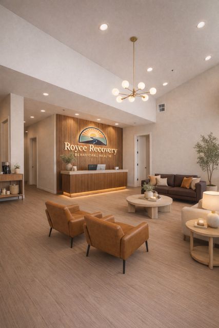 Royce Recovery lobby in McKinney, Texas with warm wood paneling and leather seating